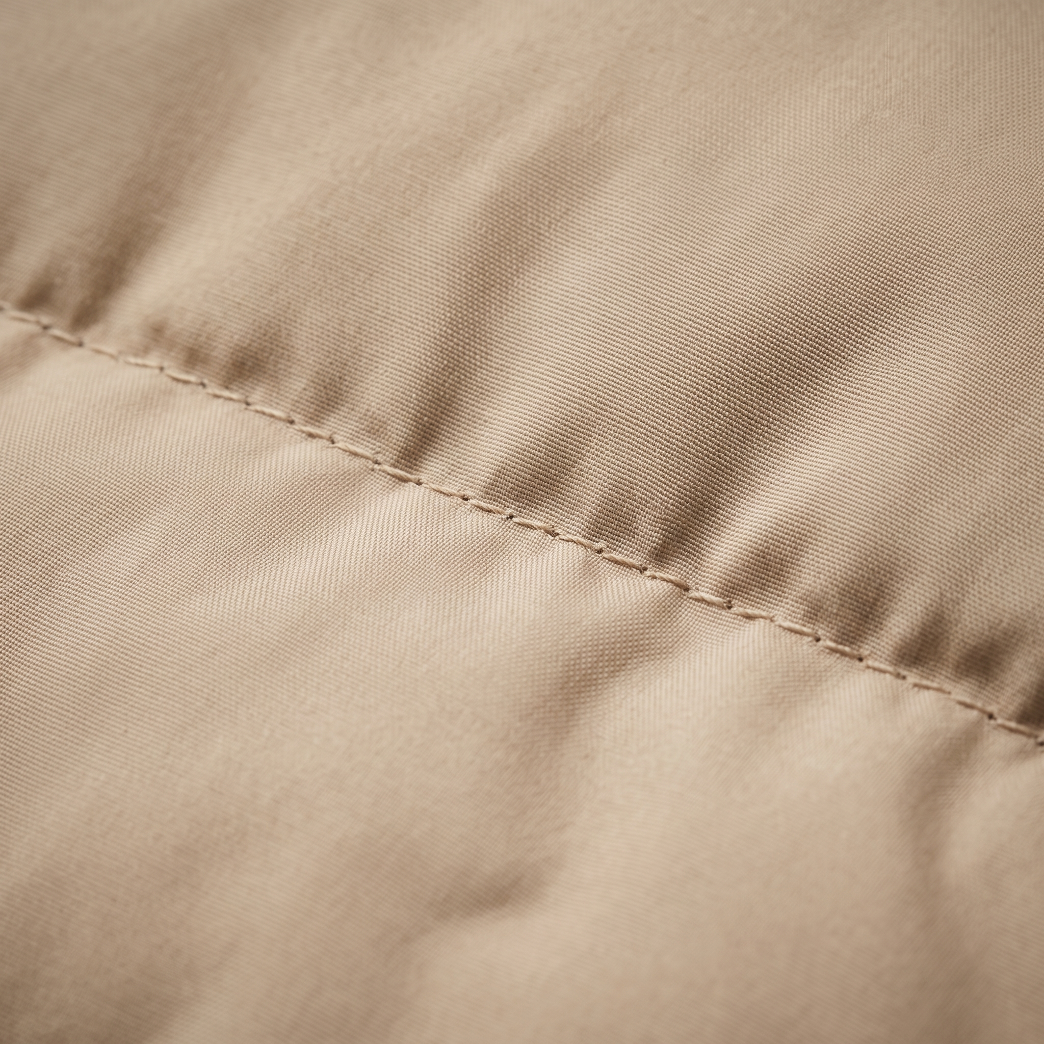 Sand beige quilted nylon fabric macro